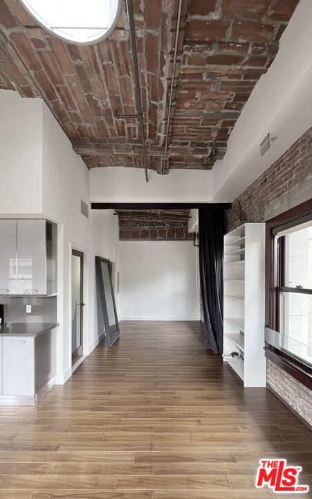 460 South Spring Street, Unit 1211 Los Angeles, CA 90013 - Photo 13 of 26 a view of empty room with wooden floor