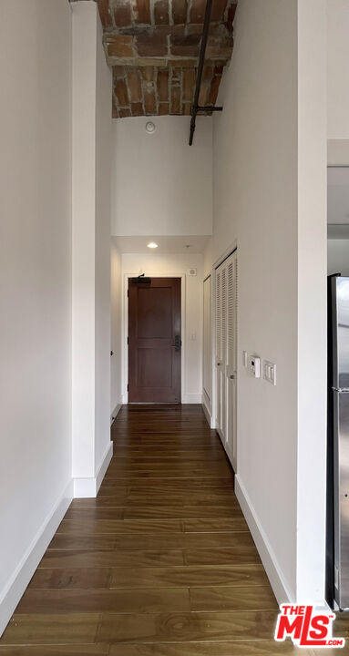 460 South Spring Street, Unit 1211 Los Angeles, CA 90013 - Photo 10 of 26 a view of a hallway with wooden floor and staircase