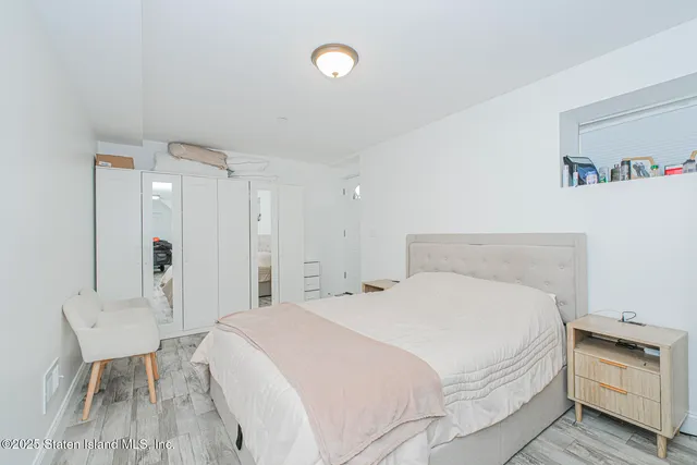 a bedroom with a bed and a table