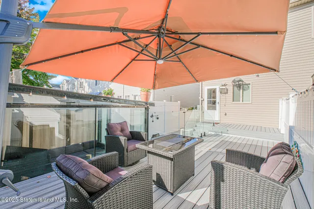 a view of a patio with a table and chairs