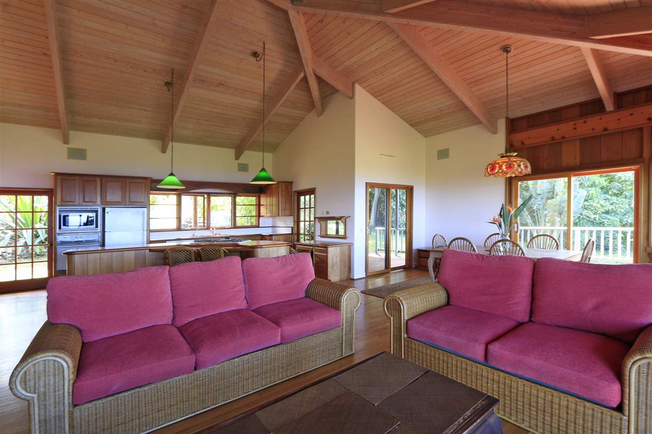 13434 Kula Highway Kula, HI 96790 - Photo 9 of 30 a living room with furniture a large window with kitchen view