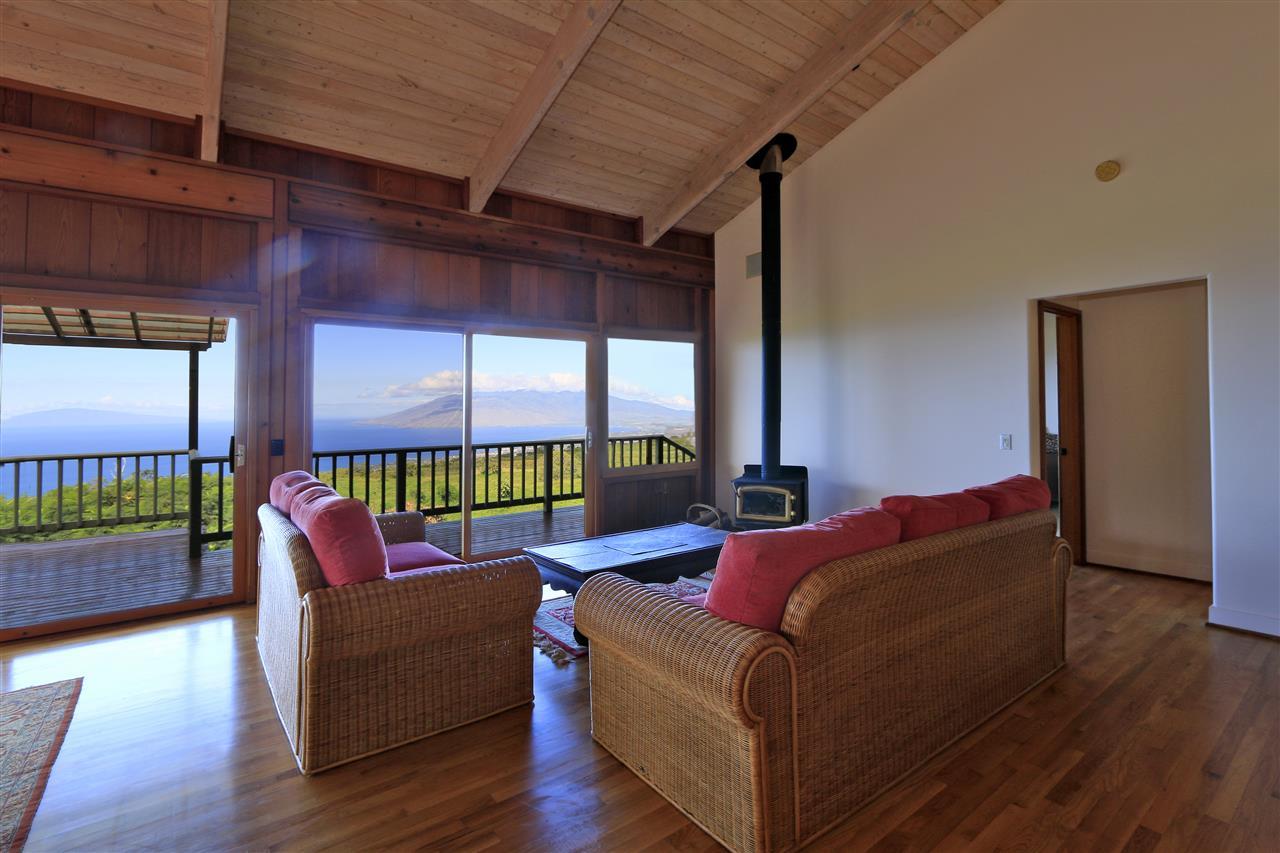 13434 Kula Highway Kula, HI 96790 - Photo 10 of 30 a living room with furniture and a floor to ceiling window