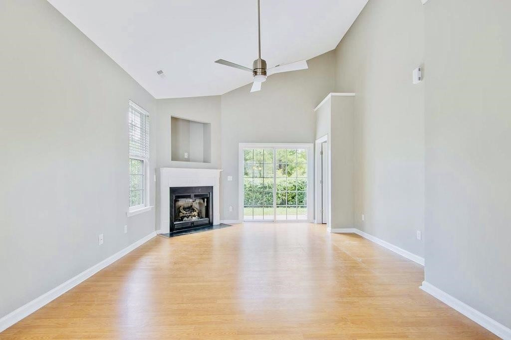 3609 Sugar Tree Place Durham, NC 27713 - Photo 12 of 22 a view of an empty room with a fireplace and a window