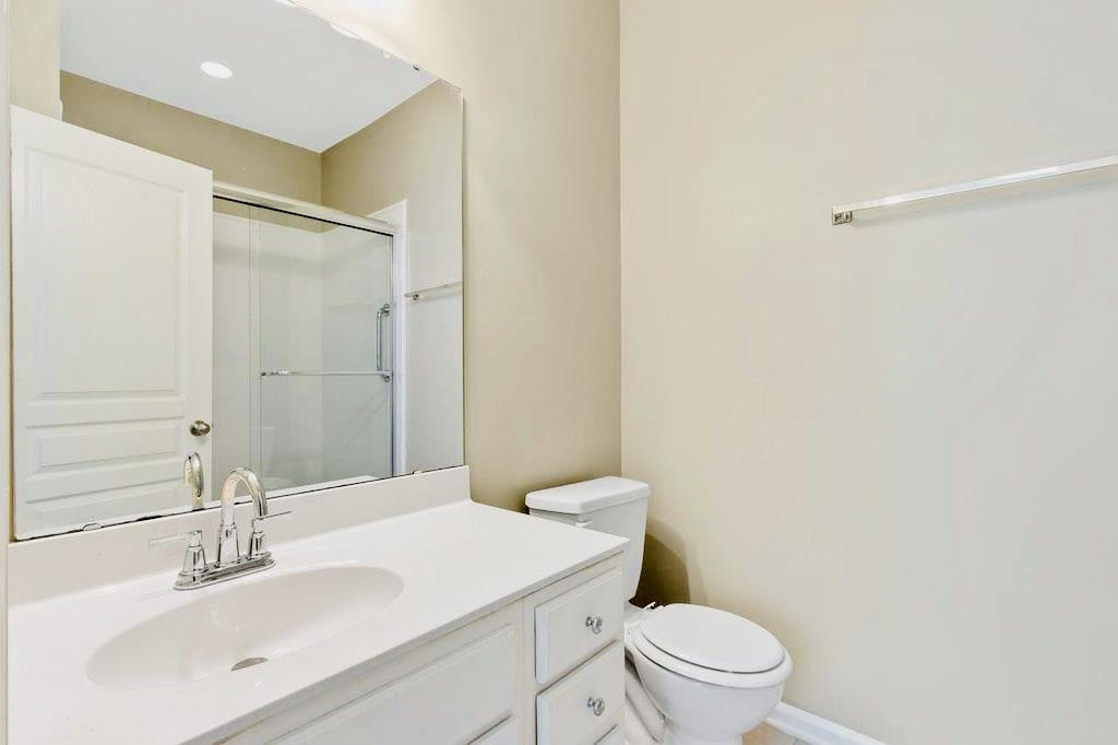 3609 Sugar Tree Place Durham, NC 27713 - Photo 15 of 22 a bathroom with a sink a toilet and a mirror