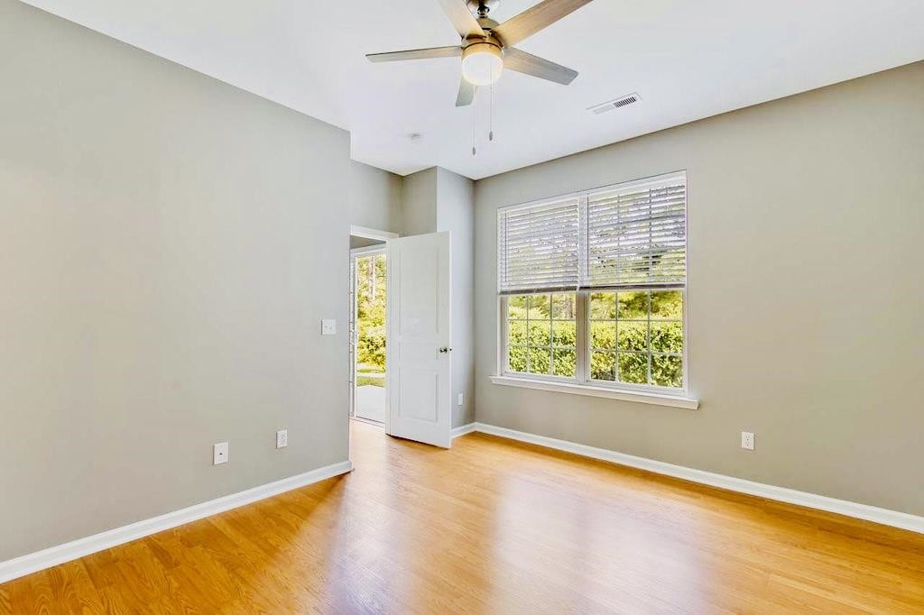 3609 Sugar Tree Place Durham, NC 27713 - Photo 16 of 22 an empty room with a window and a ceiling fan