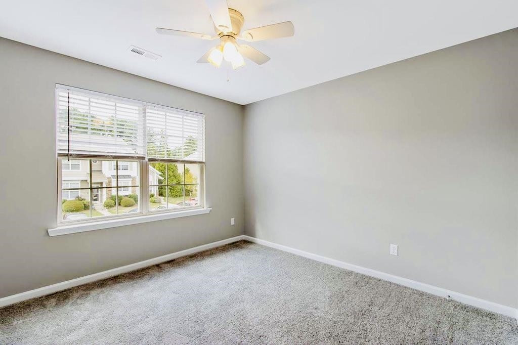 3609 Sugar Tree Place Durham, NC 27713 - Photo 18 of 22 an empty room with a window and a fan