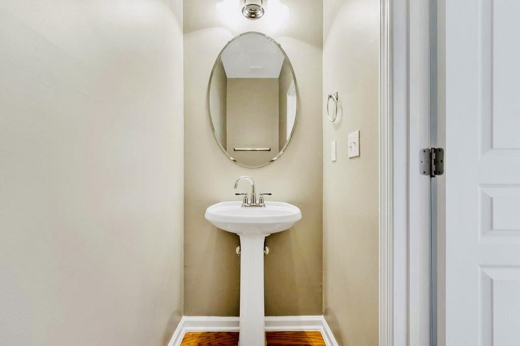 3609 Sugar Tree Place Durham, NC 27713 - Photo 4 of 22 a bathroom with a sink and a mirror