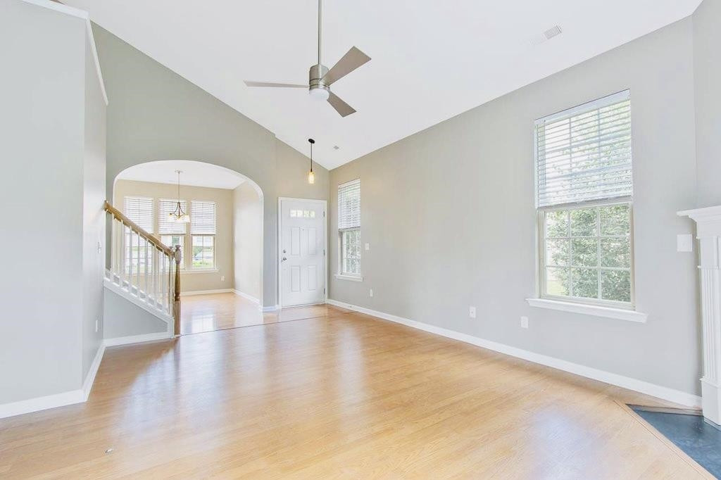 3609 Sugar Tree Place Durham, NC 27713 - Photo 10 of 22 an empty room with wooden floor fan and windows