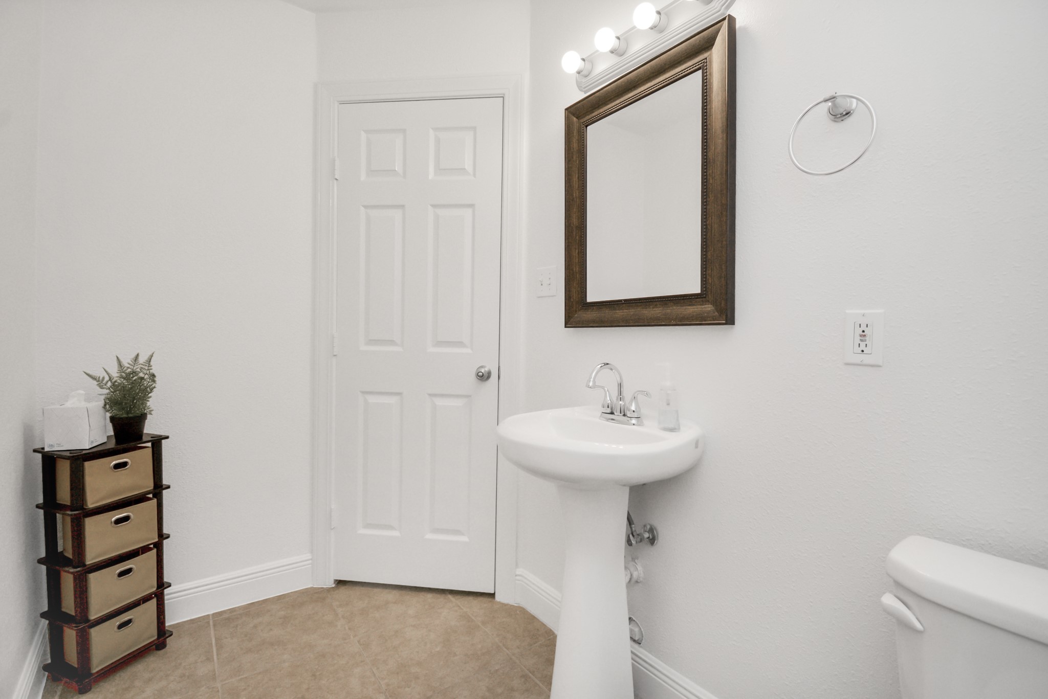7830 Pardee Street Houston, TX 77028 - Photo 11 of 24 a bathroom with a sink mirror and toilet