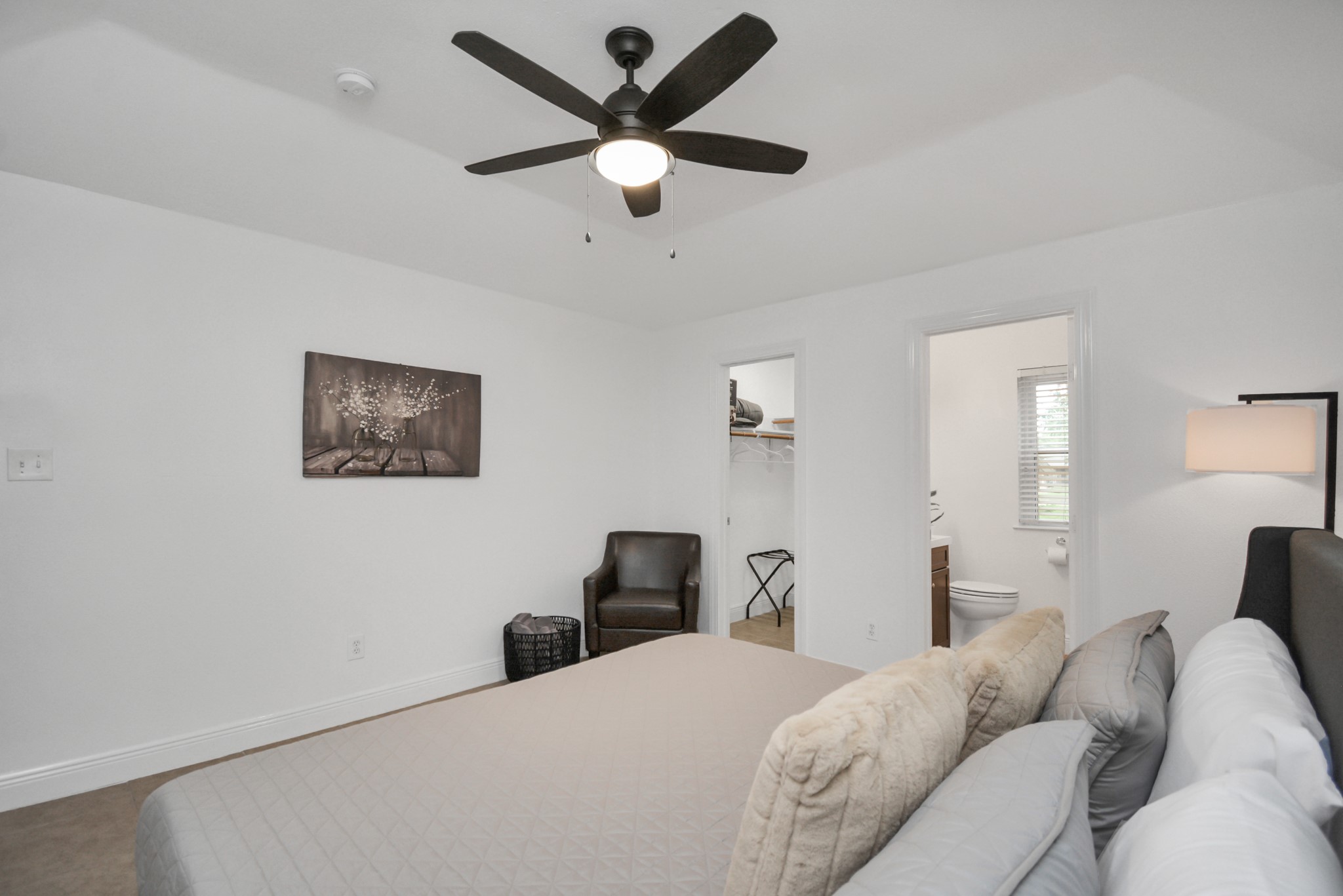 7830 Pardee Street Houston, TX 77028 - Photo 12 of 24 a bedroom with a bed and a large mirror