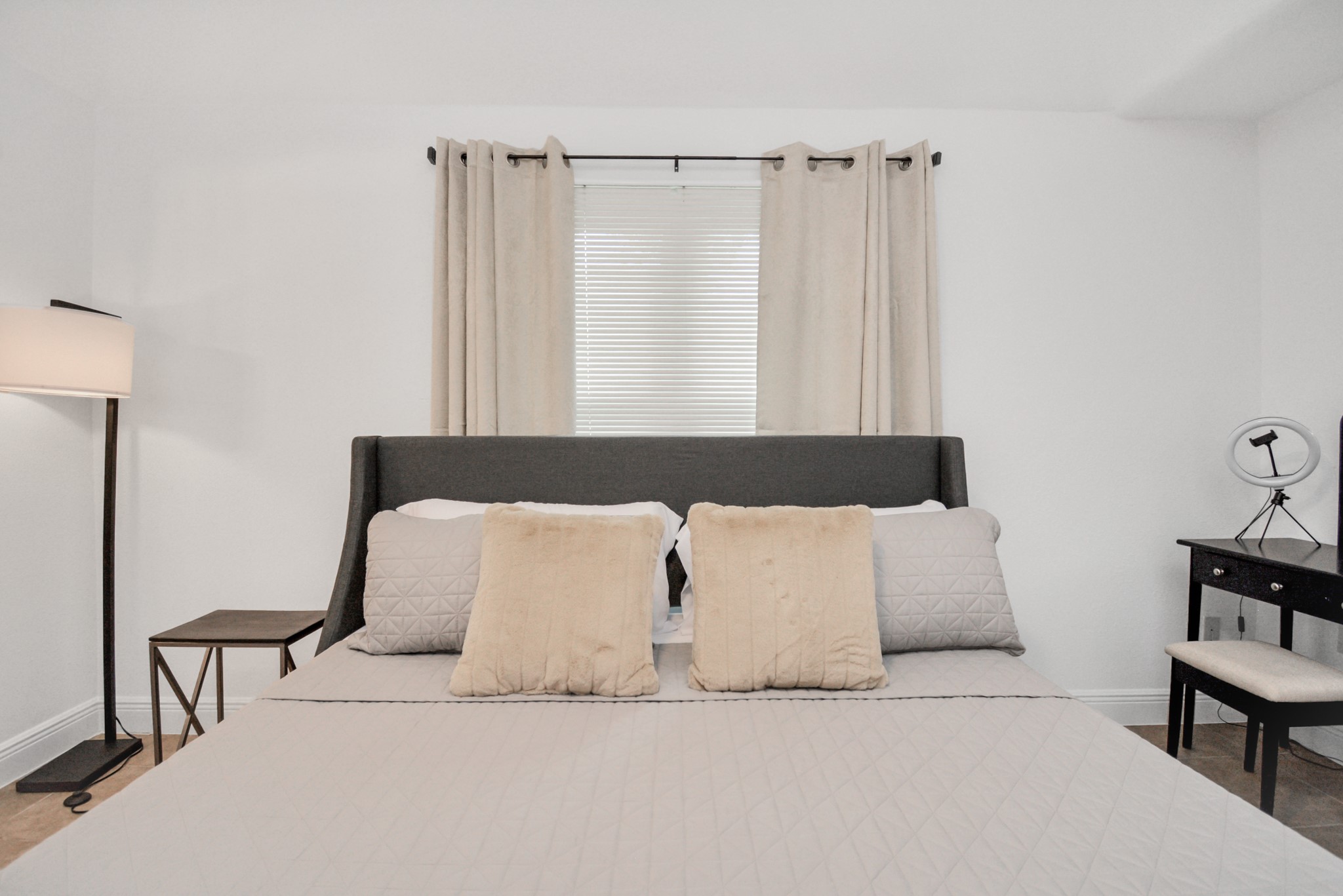 7830 Pardee Street Houston, TX 77028 - Photo 13 of 24 a bedroom with a bed and a night stand