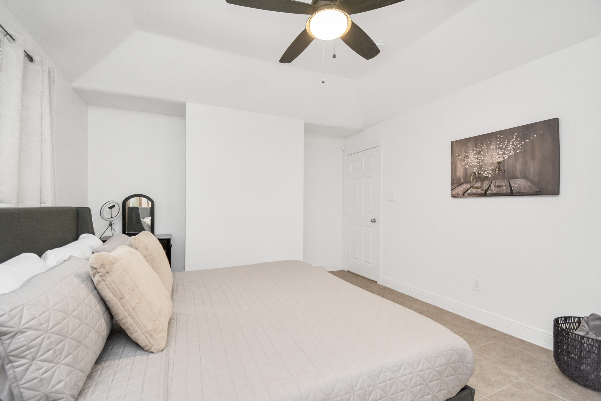 7830 Pardee Street Houston, TX 77028 - Photo 14 of 24 a bedroom with bed and a chandelier