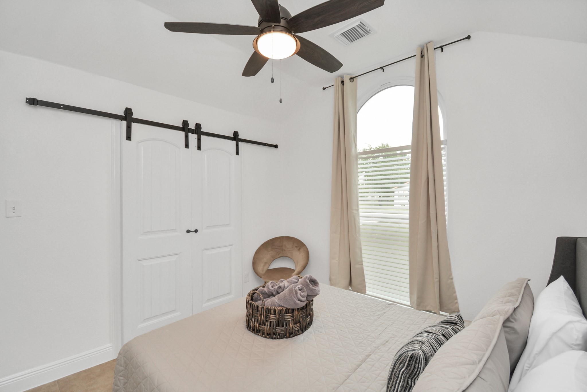 7830 Pardee Street Houston, TX 77028 - Photo 21 of 24 a bed room with a bed and a chandelier