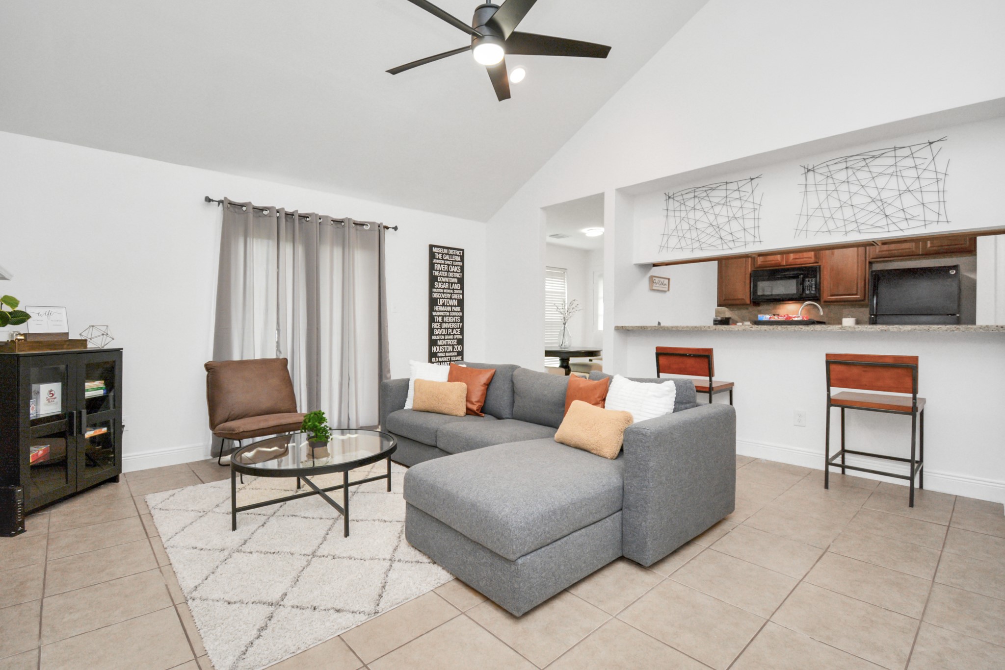 7830 Pardee Street Houston, TX 77028 - Photo 4 of 24 a living room with furniture and a flat screen tv