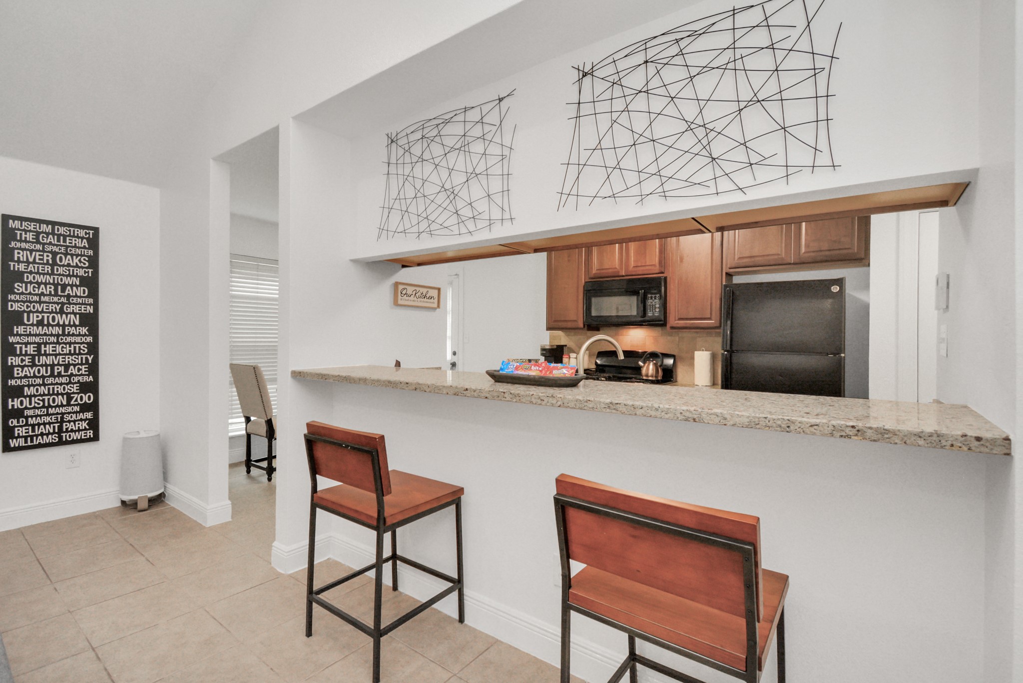 7830 Pardee Street Houston, TX 77028 - Photo 6 of 24 a kitchen with stainless steel appliances granite countertop a sink and cabinets