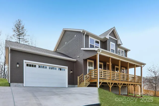 a front view of a house with a garage