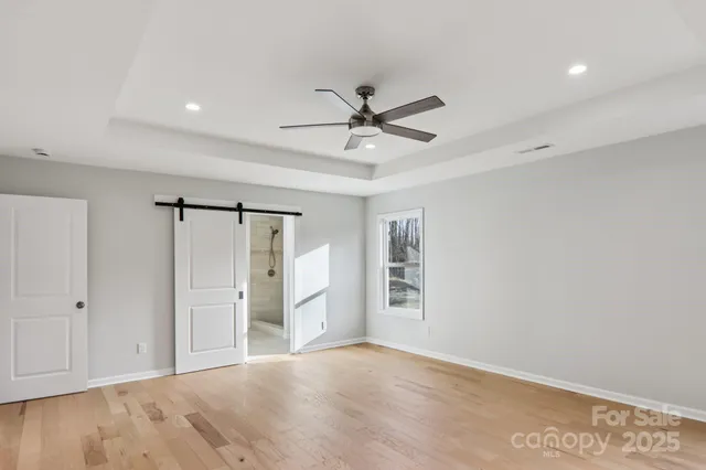 a bathroom with a granite countertop shower sink and mirror