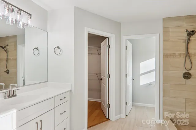 a bathroom with a shower and a toilet