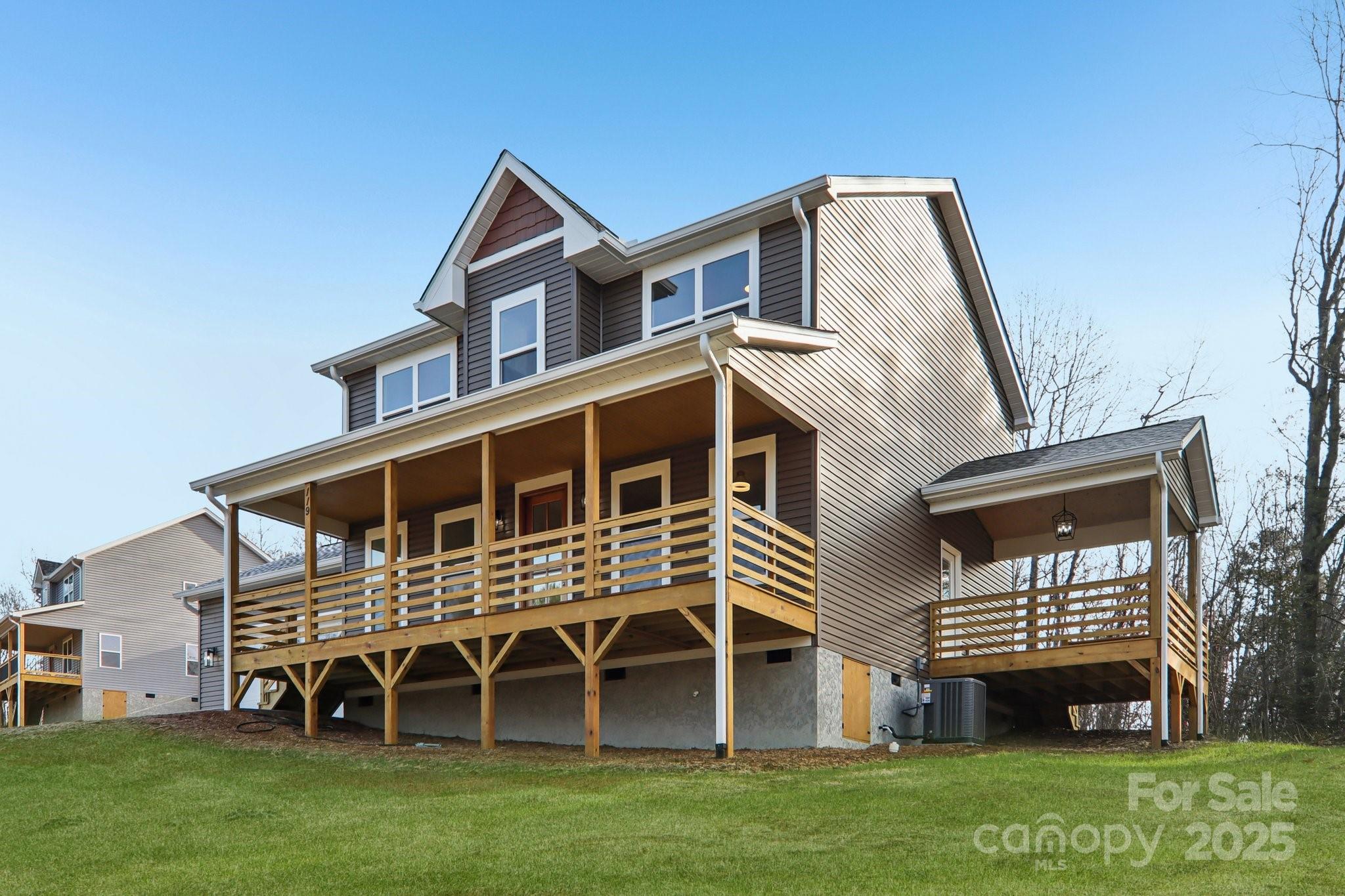 119 Lincoln Rdg Drive, Unit 1 Candler, NC 28715 - Photo 3 of 44 a front view of a house with a garden