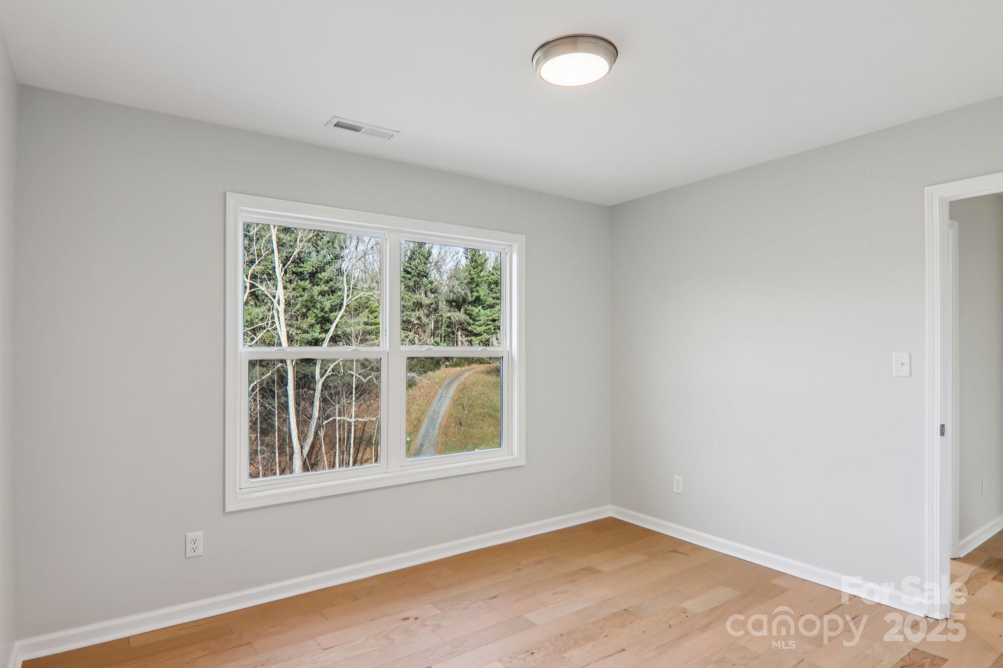 119 Lincoln Rdg Drive, Unit 1 Candler, NC 28715 - Photo 38 of 44 an empty room with a window