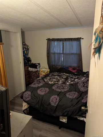 a bedroom with a bed and a closet