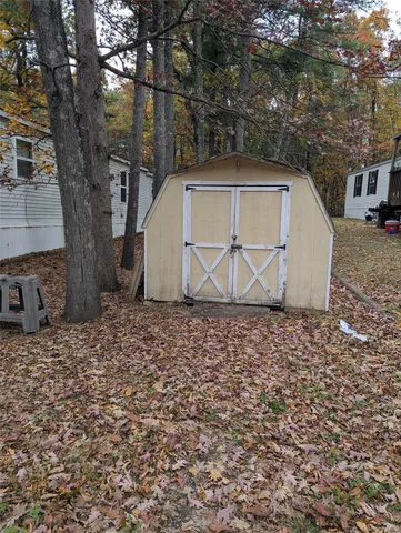 a house with trees in the background