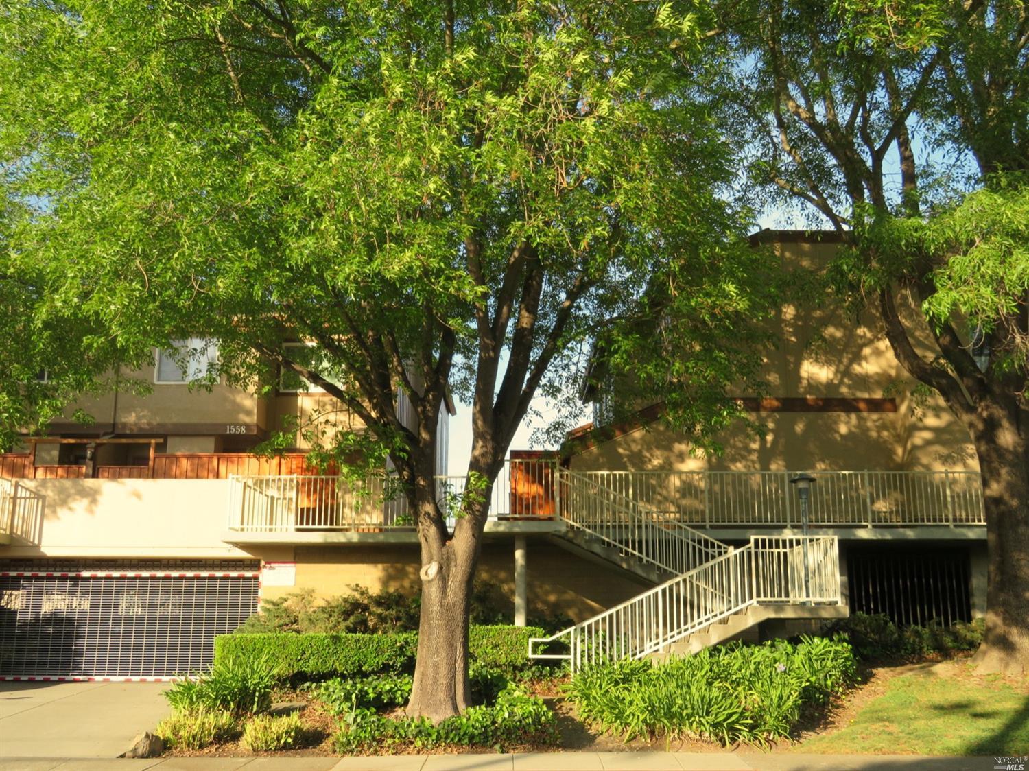 1556 Center Road, Unit 14 Novato, CA 94947 - Photo 1 of 1 a front view of a house with a yard