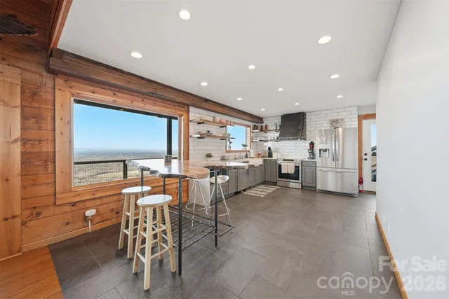 a living room with lots of furniture and white doors