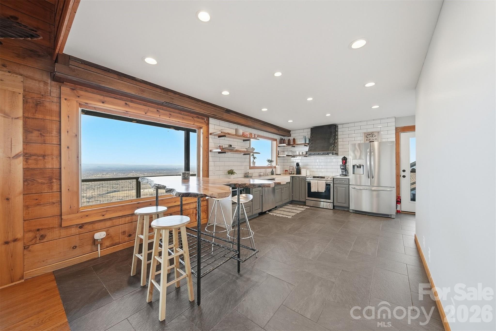 6500 Burkemont Road Morganton, NC 28655 - Photo 12 of 48 a living room with lots of furniture and white doors