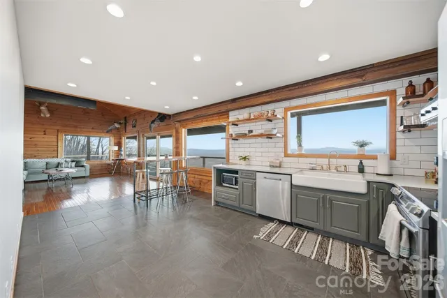 a kitchen with lots of counter top space and dining table
