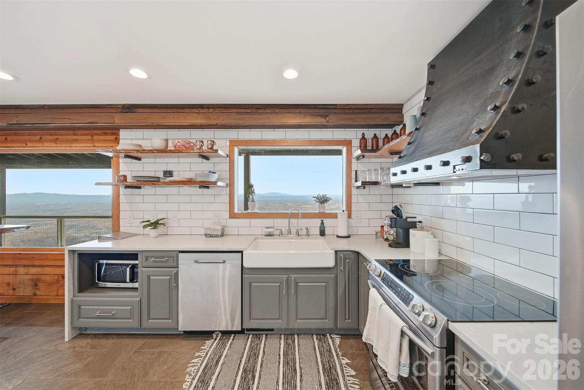 6500 Burkemont Road Morganton, NC 28655 - Photo 15 of 48 a kitchen with a sink stove and cabinets