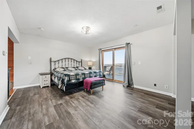 a bedroom with furniture and a window