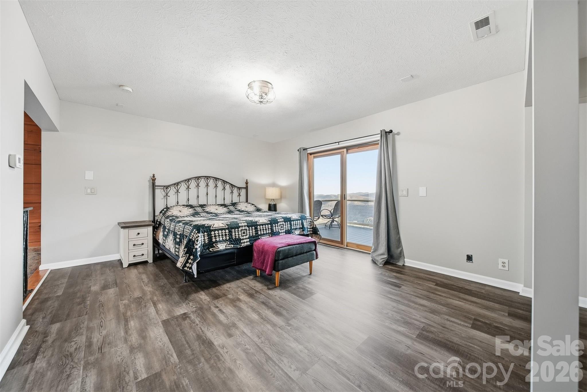 6500 Burkemont Road Morganton, NC 28655 - Photo 17 of 48 a bedroom with furniture and a window