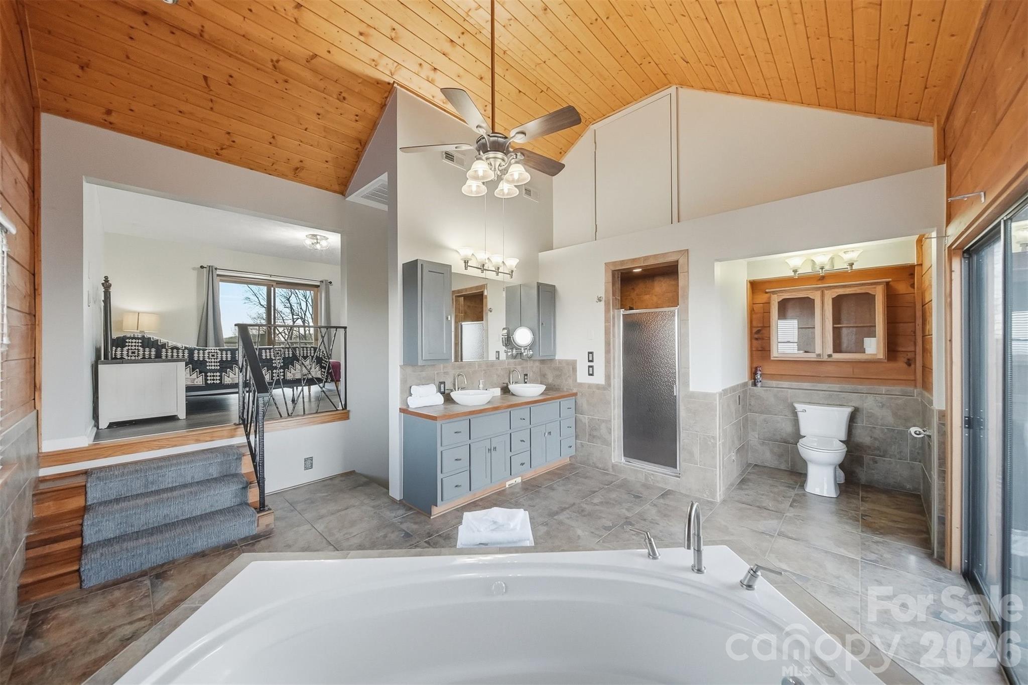 6500 Burkemont Road Morganton, NC 28655 - Photo 19 of 48 a view of a bathroom with a tub shower and fireplace