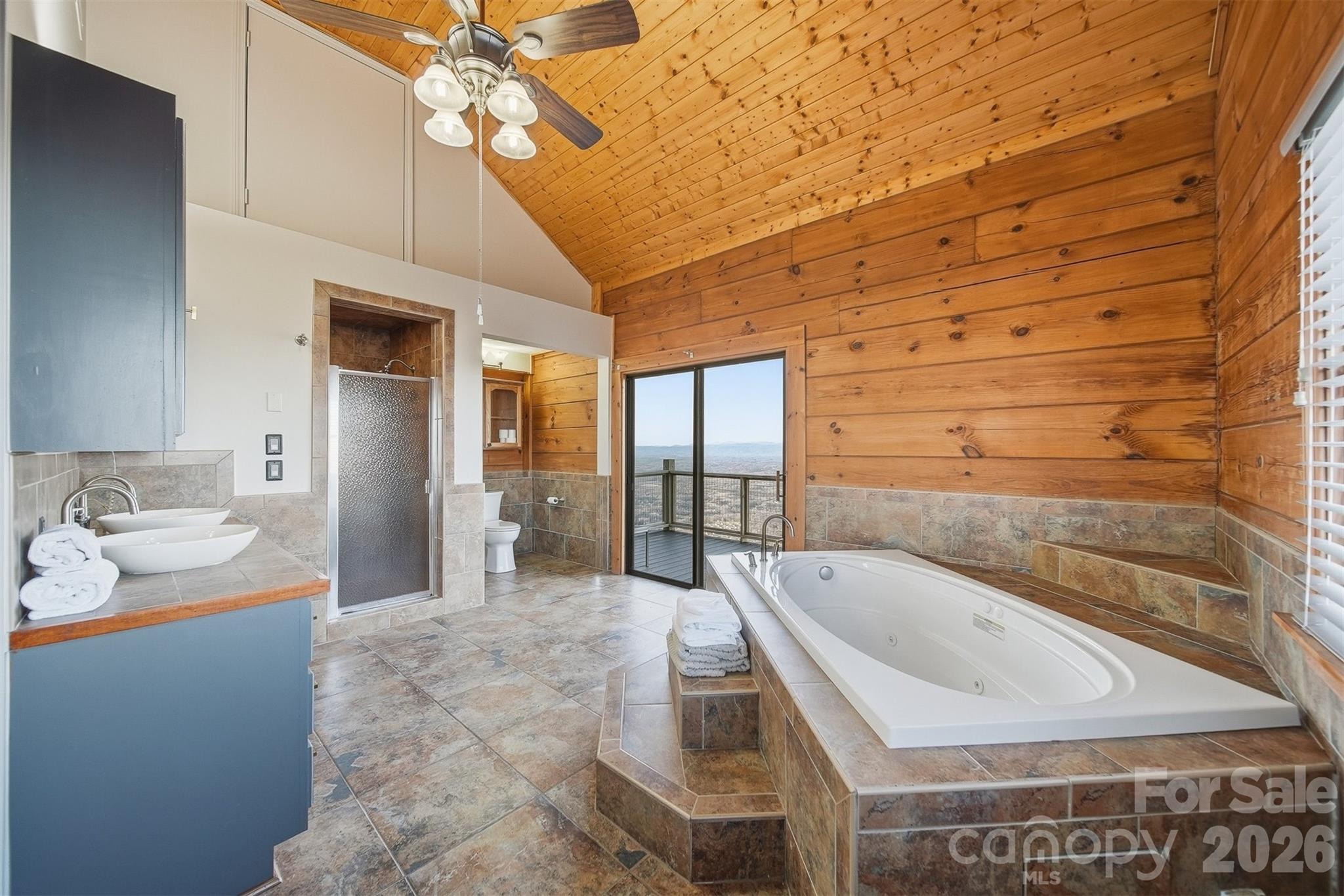 6500 Burkemont Road Morganton, NC 28655 - Photo 20 of 48 a bathroom with a tub sink and mirror