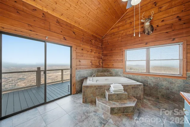 a bathroom with a toilet and shower