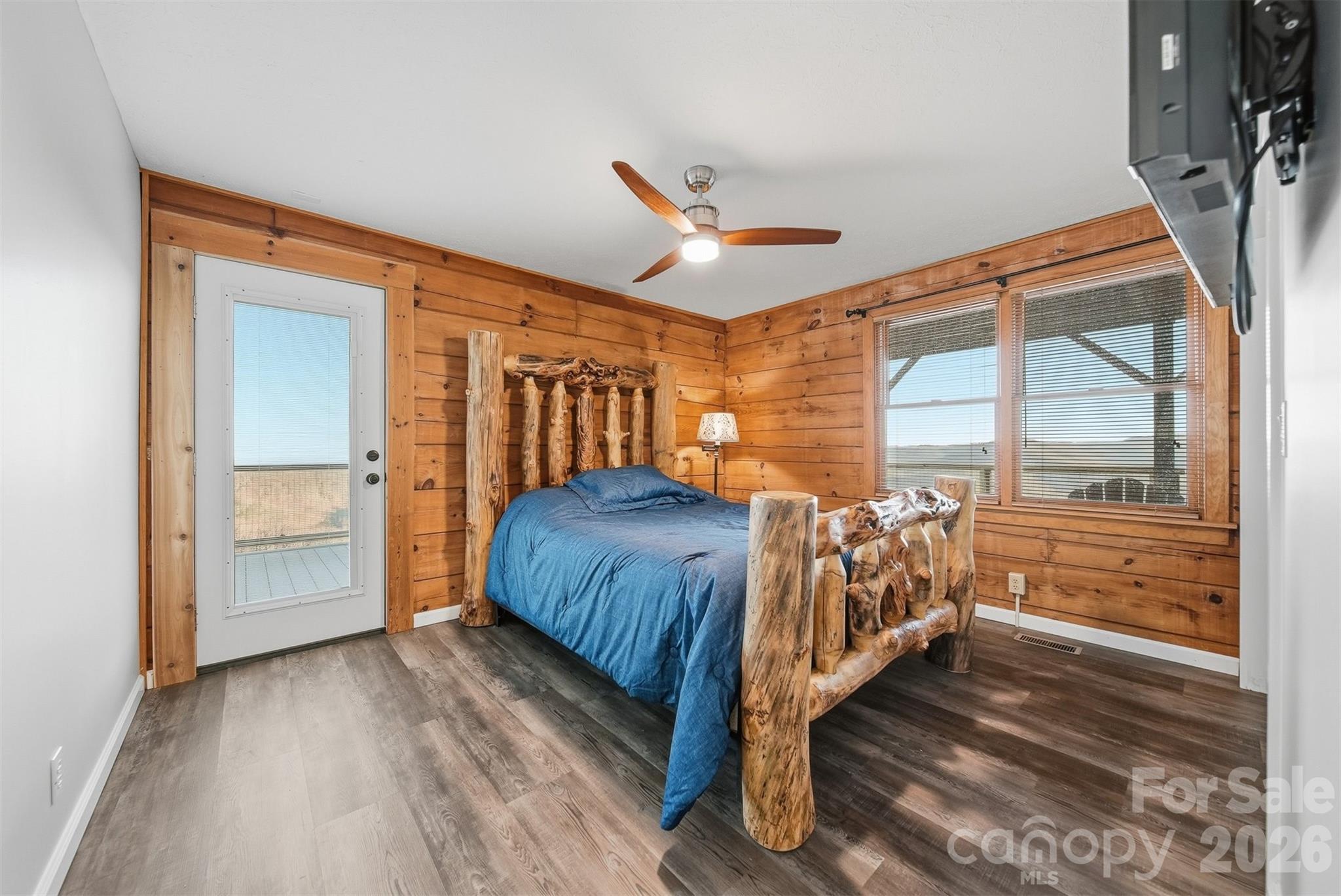 6500 Burkemont Road Morganton, NC 28655 - Photo 24 of 48 a bedroom with a bed next to a large window