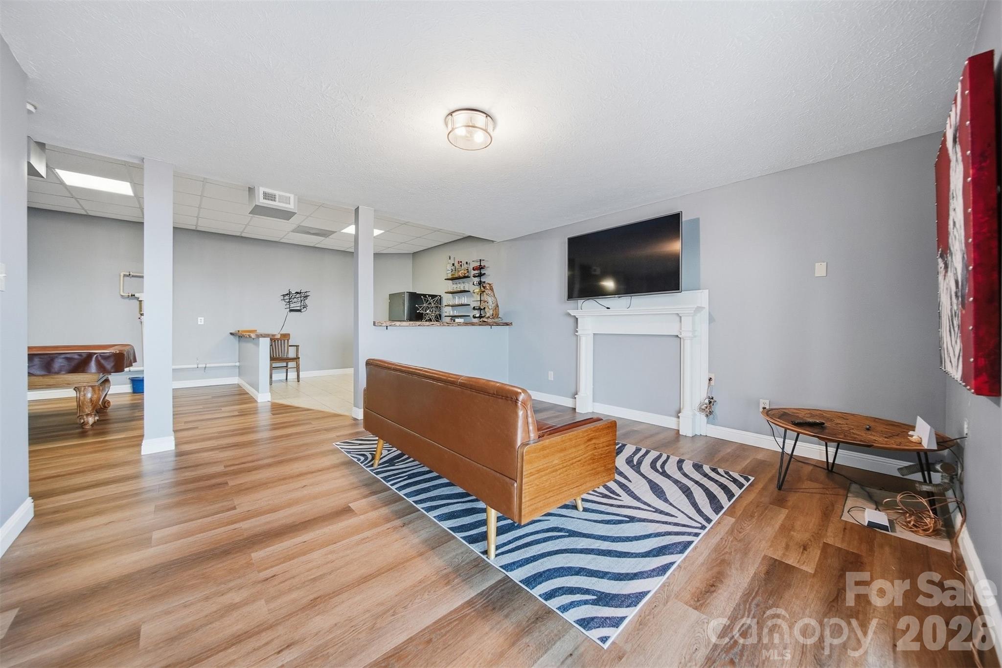 6500 Burkemont Road Morganton, NC 28655 - Photo 27 of 48 a living room with furniture and a flat screen tv
