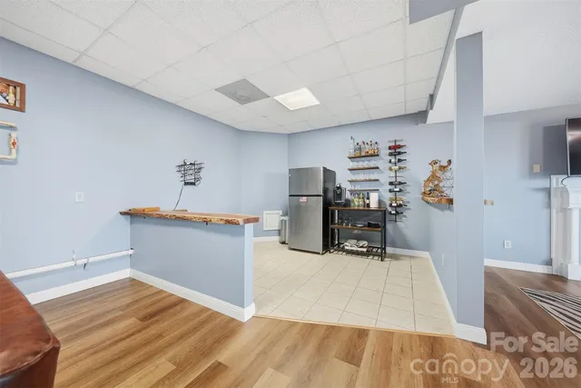 a bedroom with a bed and a mirror