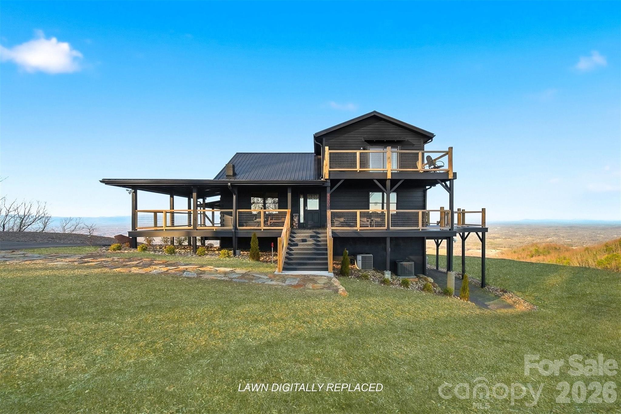 6500 Burkemont Road Morganton, NC 28655 - Photo 3 of 48 a front view of a house with a yard