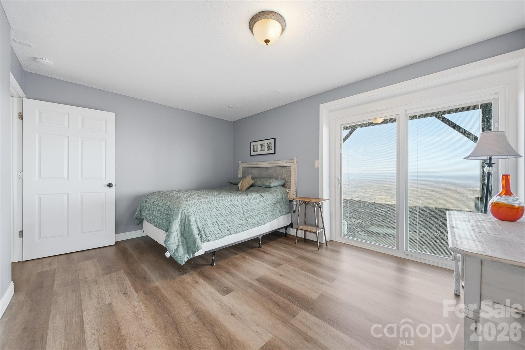 6500 Burkemont Road Morganton, NC 28655 - Photo 31 of 48 a bedroom with a bed and a mirror