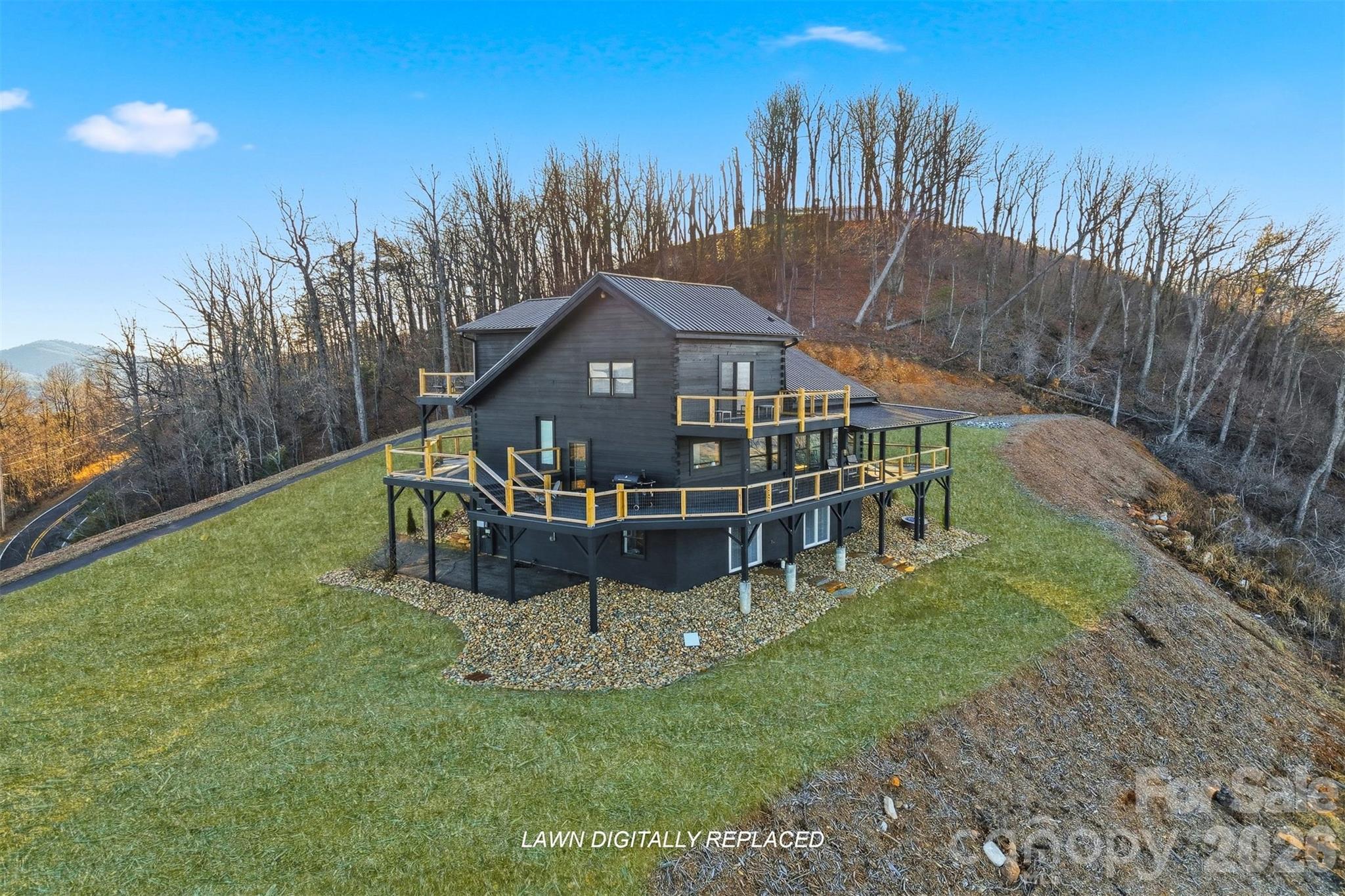 6500 Burkemont Road Morganton, NC 28655 - Photo 5 of 48 a view of a house with a big yard and large trees