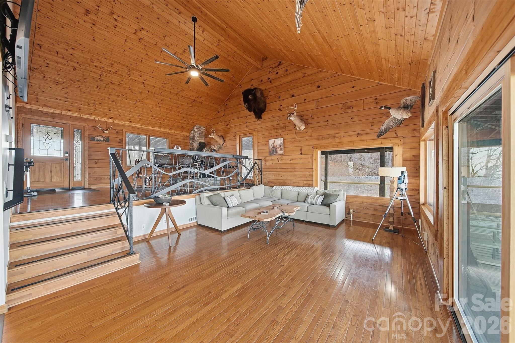 6500 Burkemont Road Morganton, NC 28655 - Photo 6 of 48 a view of a patio with table and chairs with wooden floor