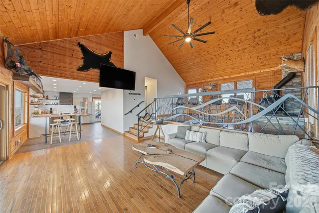 a view of a livingroom with furniture and a flat screen tv