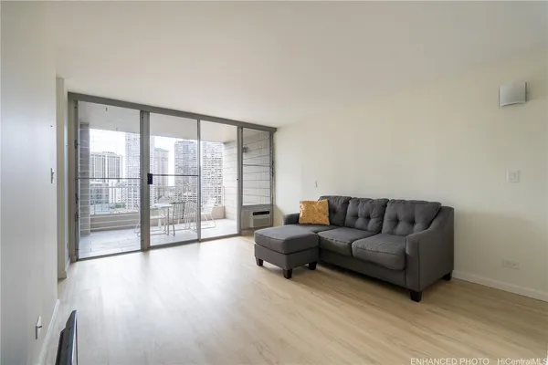 a view of an empty room and wooden floor