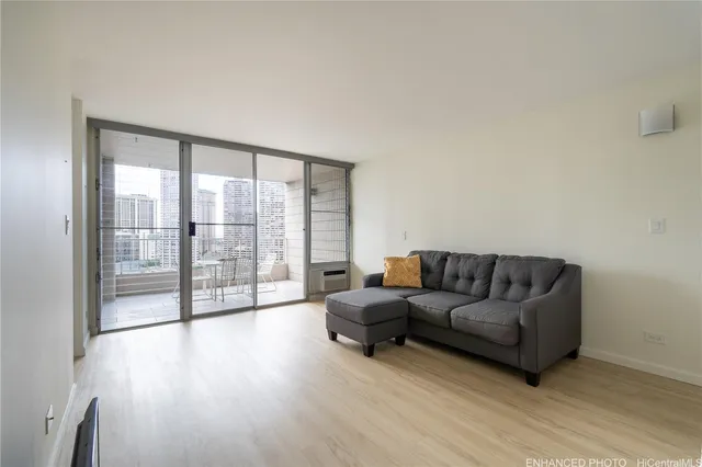 a view of an empty room and wooden floor