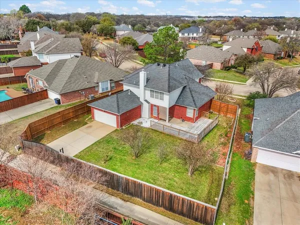 an aerial view of a house with a garden