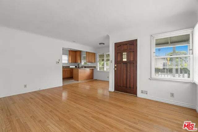 a view of a kitchen cabinets and wooden floor