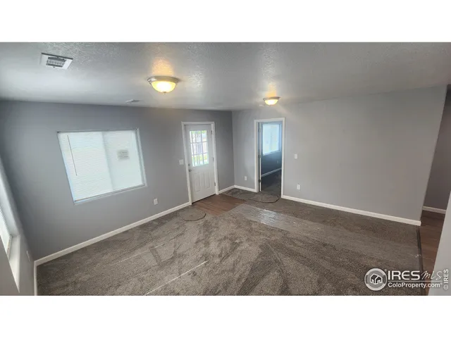 a black and white photo of a living room