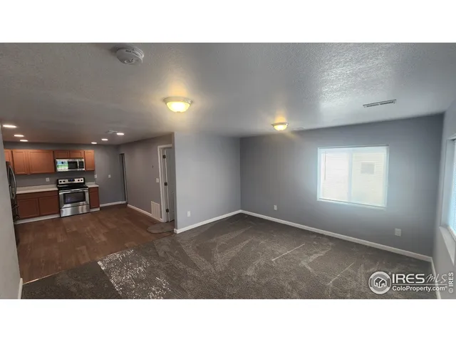 a kitchen with cabinets and stainless steel appliances